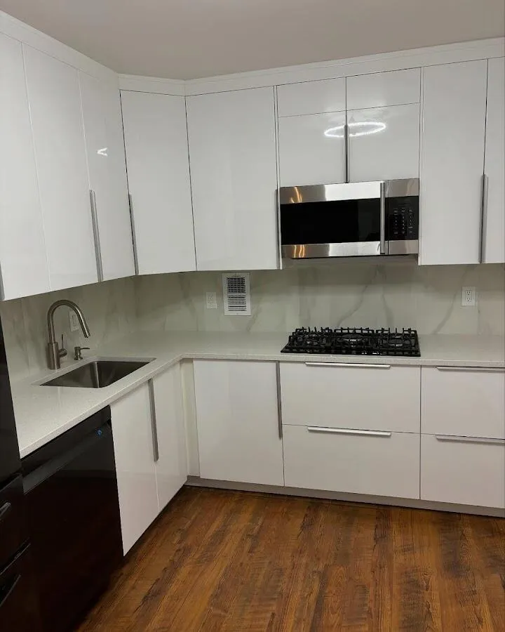 Restored kitchen with white cabinets after water damage in Brunswick
